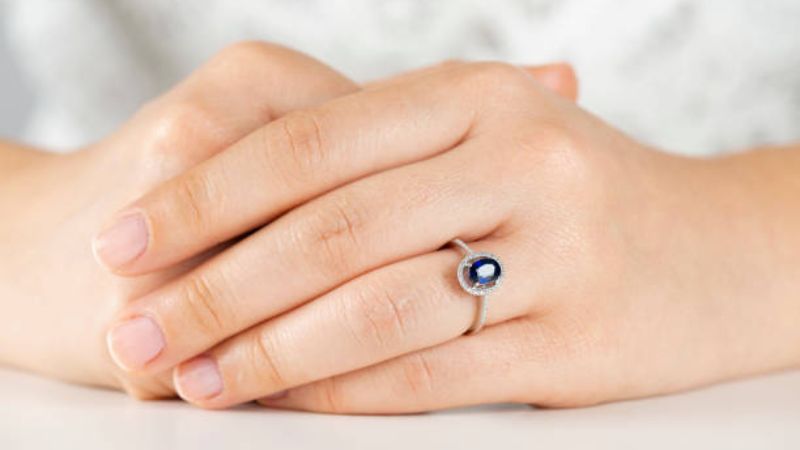 Sapphire Ring on Woman's Hand Finger