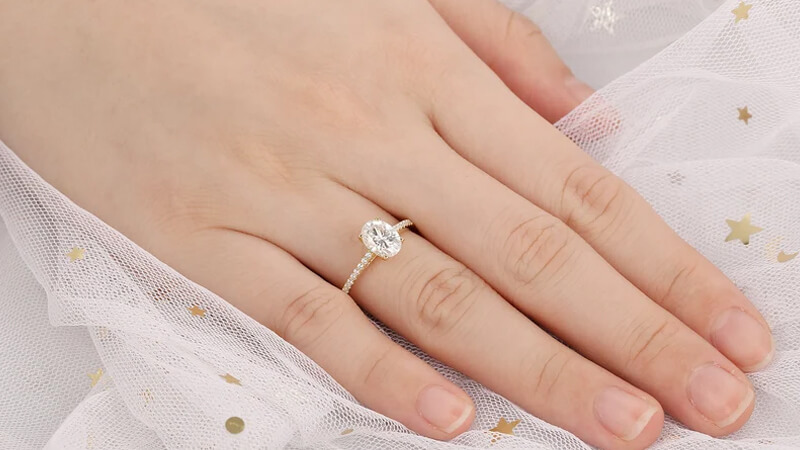 oval cut moissanite engagement ring in gold metal