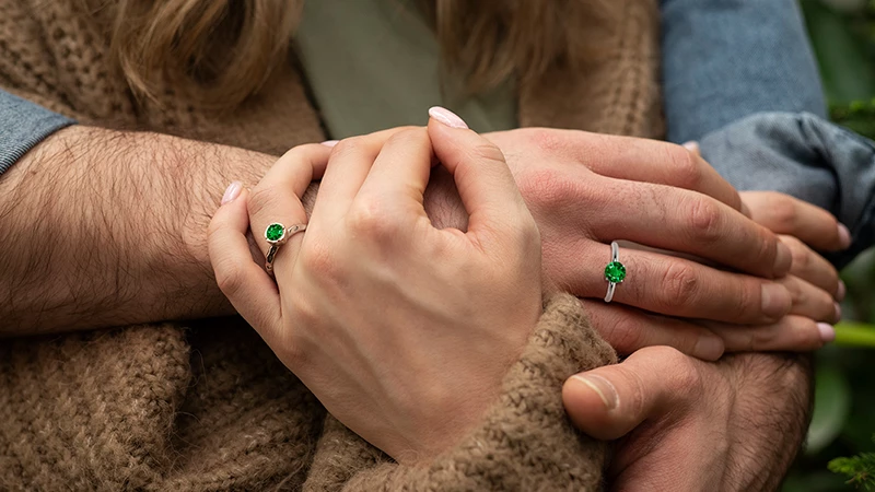 man & a woman wearing similar rings