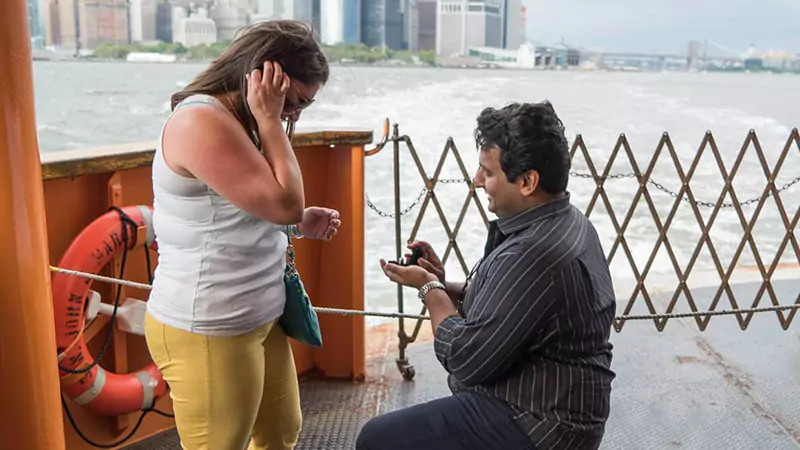 guy proposing his girlfriend in The Staten Island Ferry 