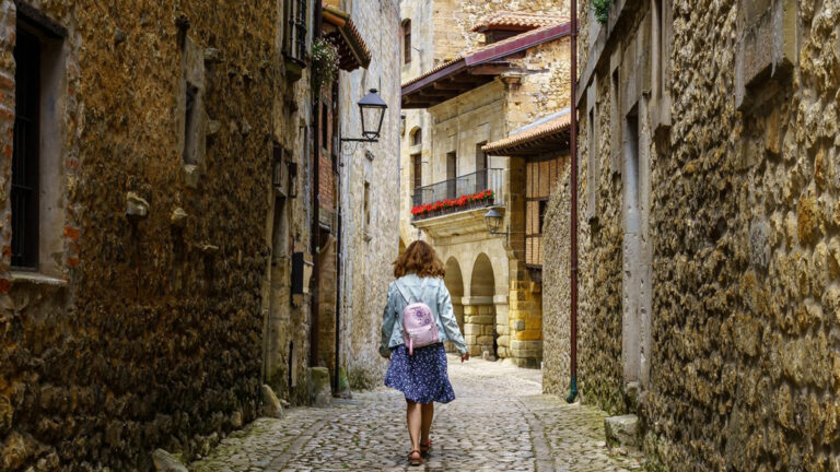 Old French village with a single woman walking